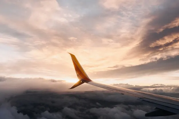 A wing in a pink evening sky: long-haul arrivals call for a gentle first day.