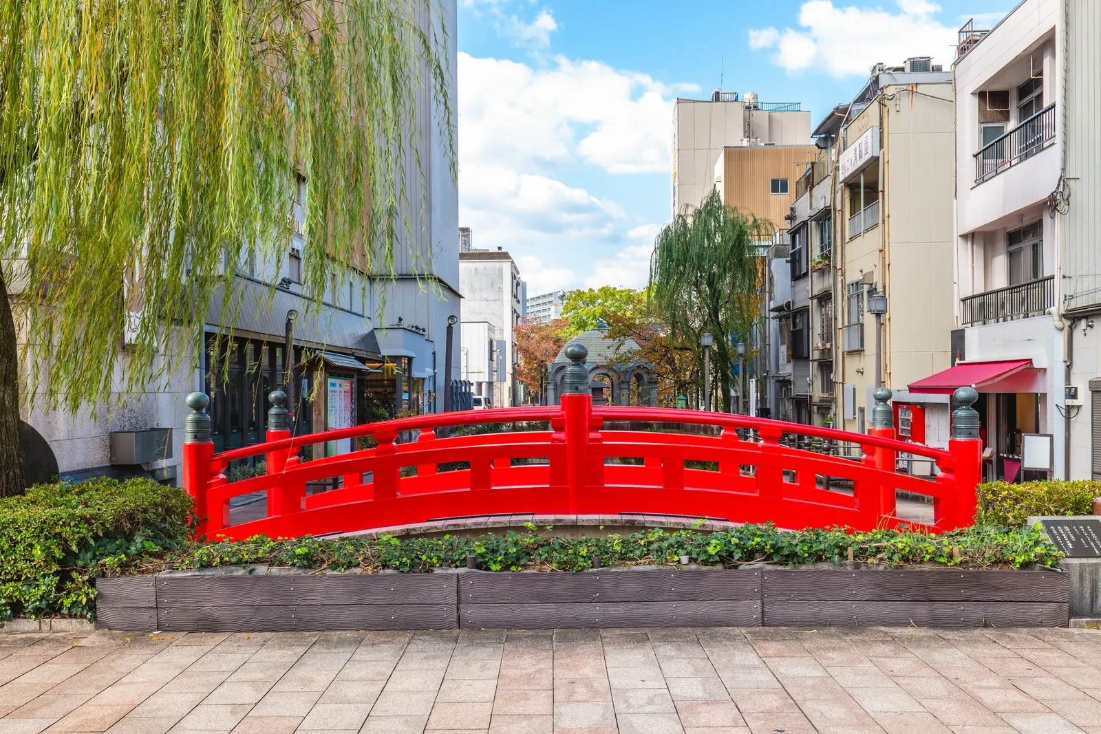 The Harimaya Bridge in central Kochi: a small red bridge with a famous love story, best shown on a short walk rather than as a stop of its own.