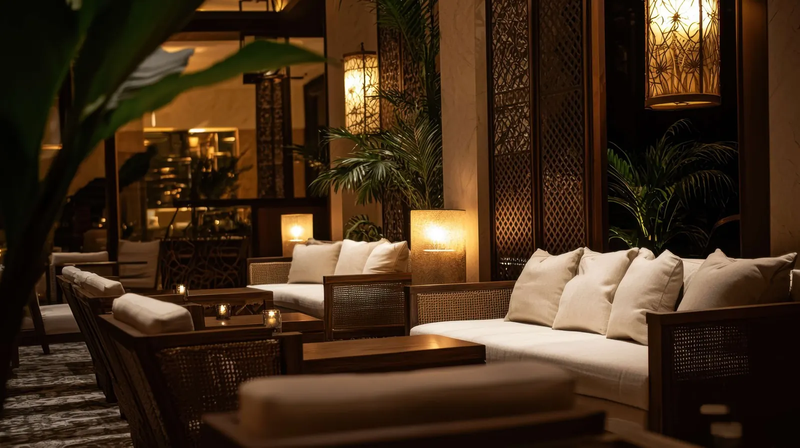 A quiet hotel lounge with soft chairs and warm lighting.