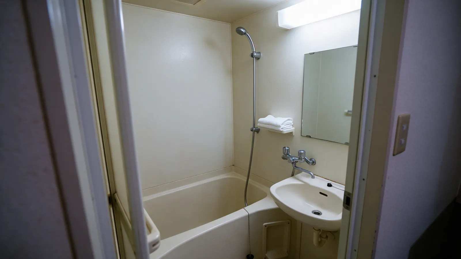 A compact unit bathroom: clean and practical but small, and worth briefing clients about.