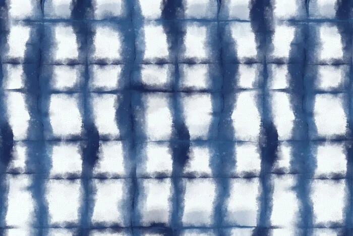 Indigo-dyed cloth with a folded and clamped pattern: a short dyeing session gives each guest a piece to take home.