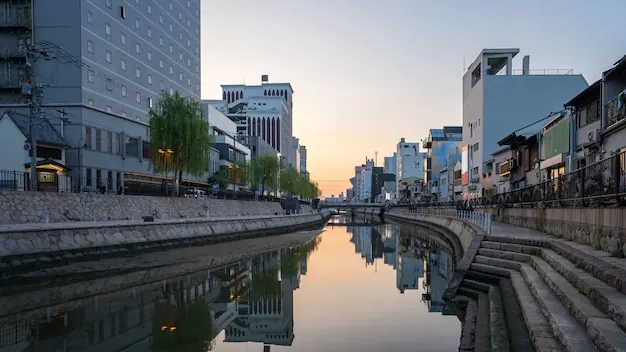 The Naka River in Fukuoka at dusk, with buildings on both banks.