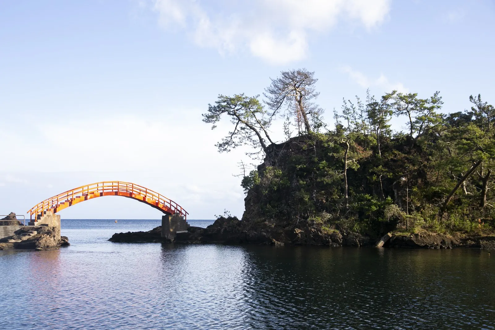 A red bridge over volcanic rocks on Sado Island, Niigata.