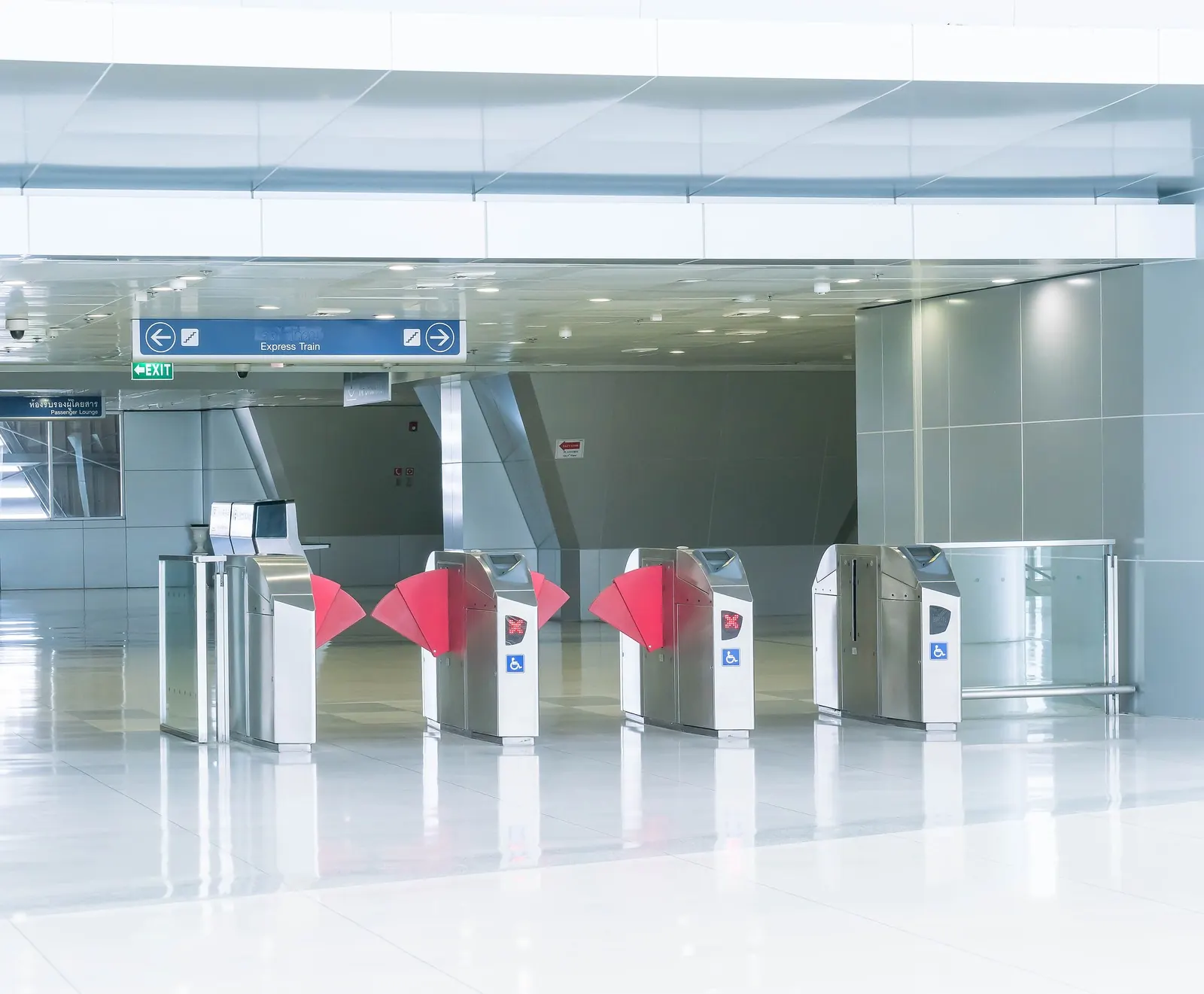 A row of ticket gates at the entrance to a station.